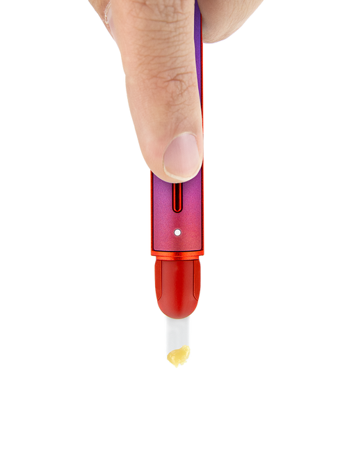 Puffco Hot Knife Plasma limited edition held in hand loading concentrate